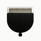 Studio product shot of a black and silver replacement clipper blade attachment featuring fine metal teeth and a ridged casing.