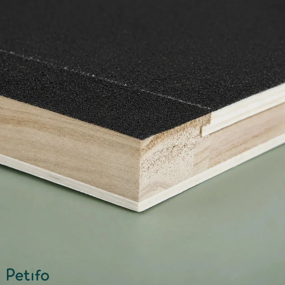 Macro close-up shot showing the textured abrasive black surface and layered wooden edge of the board.