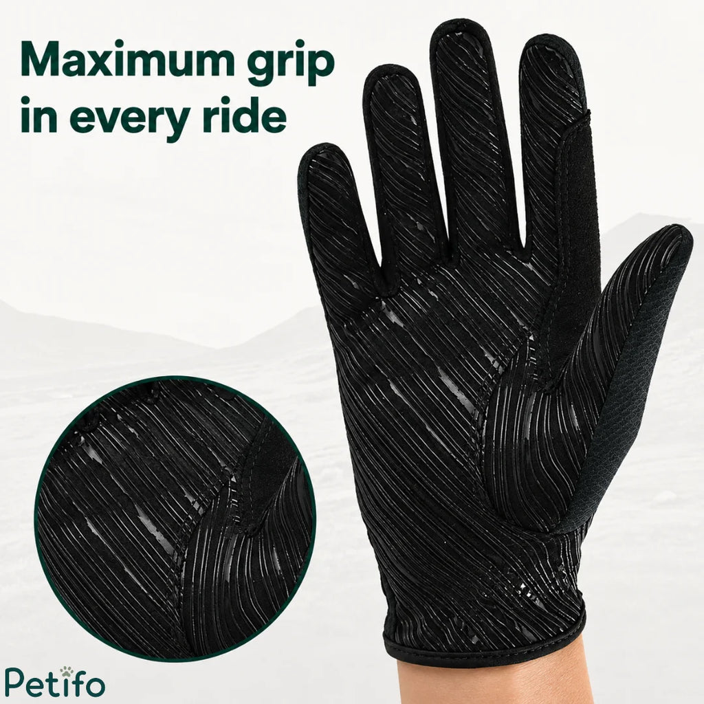 Textured patterned palm of a black equestrian riding glove designed for maximum grip.