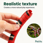 Close-up hand view showing the realistic textured segments of the interactive snake toy.