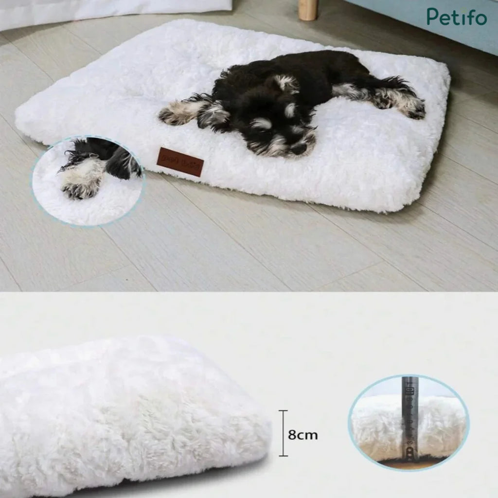 Miniature schnauzer resting on a plush white pet mat highlighting its thick 8cm profile and soft texture.
