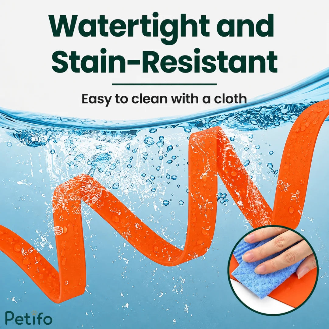 Orange leash winding through clear water, demonstrating its watertight design while a hand wipes it clean with a microfiber cloth.