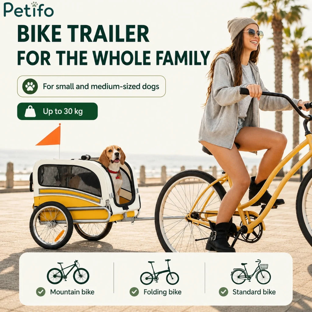 Woman riding bicycle pulling a Petifo dog bike trailer.