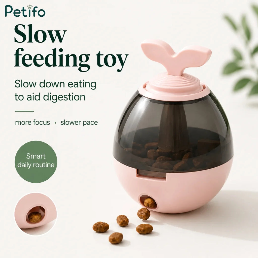 Pink Petifo sprout slow feeder toy dispensing kibble treats on smooth surface